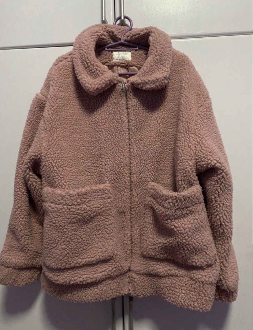 Pink Teddy Bear Fleece Jacket with Zip and Pockets (Category: Coats, Jackets and Outerwear) located in Bacoor. Submitted by _myprelovedcloset (Listing ID 1443757916, Image 2). Description: - Super cozy pink teddy bear fleece jacket - Zip-up front - Two front pockets - Lined inside for extra warmth - Perfect for chilly days - Soft and comfortable feel.