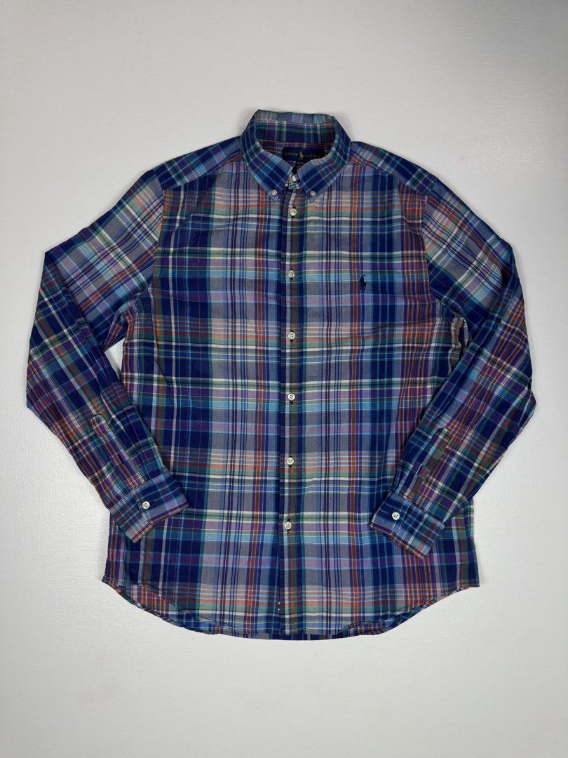 Polo Ralph Lauren Plaid Button Down Shirt (Category: Tshirts & Polo Shirts ) located in Manila. Submitted by collect__ph (Listing ID 1443705888, Image 2). Description: - Classic plaid button-down shirt - Brand: Polo Ralph Lauren - Color: Blue, purple, and green plaid pattern - Features: Button closure, embroidered pony logo on chest - Origin: Made in Indonesia - Size: 28” L x 20” W x 23” Sleeve length - Style: Perfect for casual or smart-casual o