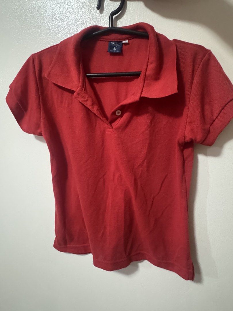 Red Short Sleeve Polo Shirt (Category: Tshirts & Polo Shirts ) located in Manila. Submitted by artipelagow (Listing ID 1443768306, Image 1). Description: - Classic red Polo Ralph Lauren polo shirt - Short sleeves with collar and two-button placket - Comfortable cotton-like fabric - Versatile for casual or sporty looks - Pairs well with jeans or shorts.