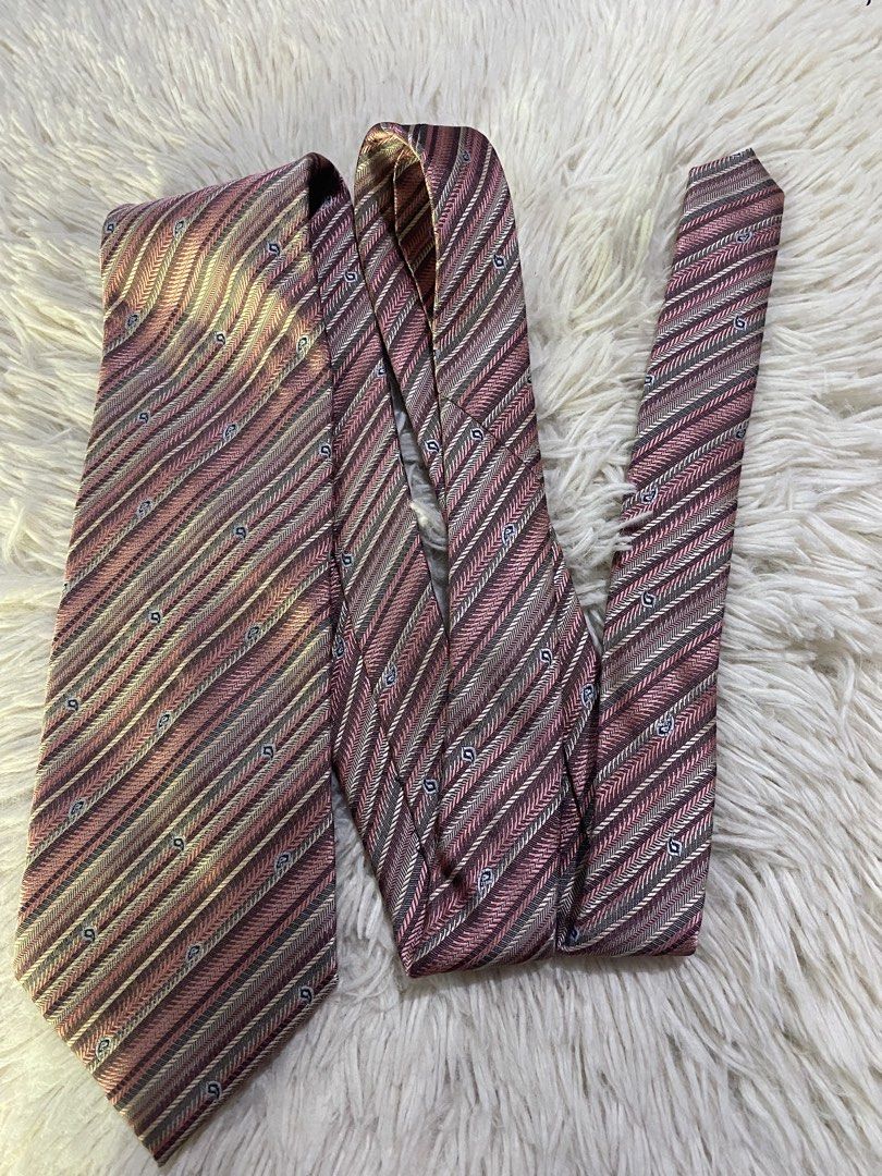 Polo Ralph Lauren Striped Silk Tie (Category: Ties) located in Bulacan. Submitted by rich2545 (Listing ID 1443715441, Image 1). Description: - Classic Polo Ralph Lauren tie - Elegant diagonal stripe pattern in pink, beige, and grey - Subtle woven paisley-like details - Made from luxurious silk - Ideal for formal events or business casual attire - A timeless and versatile accessory.