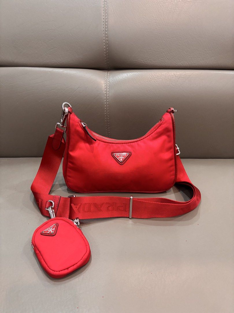 Prada Re-Edition 2005 Re-Nylon Bag (Category: Luxury Bags & Wallets) located in Manila. Submitted by beybmuffin (Listing ID 1443778313, Image 1). Description: ❤️ Stunning red colorway ❤️ Iconic enamel triangle logo ❤️ Durable Re-Nylon material ❤️ Detachable Prada logo strap ❤️ Includes removable mini pouch ❤️ Zip top closure ❤️ Lightweight & perfect for everyday use Condition: Preloved. Please review all photos carefully and manage expectations. 