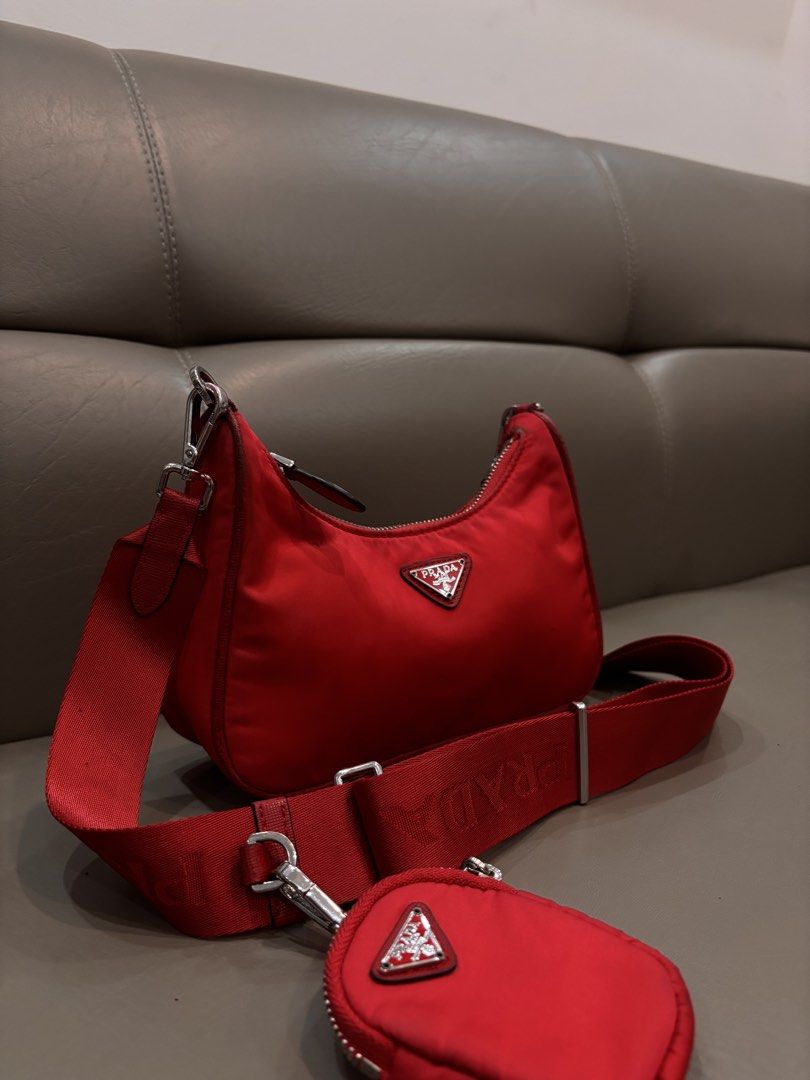Prada Re-Edition 2005 Re-Nylon Bag (Category: Luxury Bags & Wallets) located in Manila. Submitted by beybmuffin (Listing ID 1443778313, Image 2). Description: ❤️ Stunning red colorway ❤️ Iconic enamel triangle logo ❤️ Durable Re-Nylon material ❤️ Detachable Prada logo strap ❤️ Includes removable mini pouch ❤️ Zip top closure ❤️ Lightweight & perfect for everyday use Condition: Preloved. Please review all photos carefully and manage expectations. 