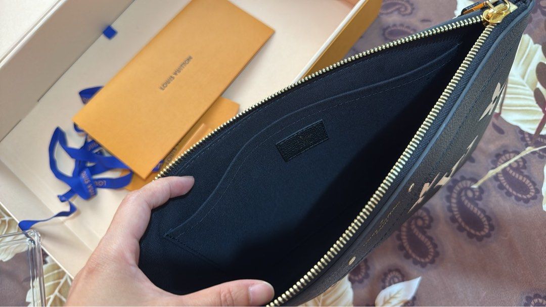 Preloved Daily Pouch m.beige (Category: Luxury Bags & Wallets) located in Manila. Submitted by ayumi017 (Listing ID 1443719678, Image 3). Description: Daily Pouch M.beige LV Clutch Unisex like new no scratch comes with box, paper bag, ribbon, receipt..
