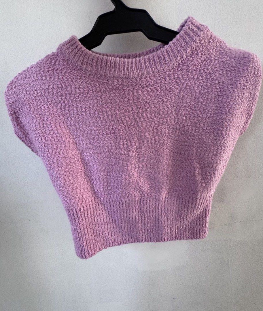 Purple Textured Knit Sweater Vest (Category: Sleeveless) located in Manila. Submitted by decluterthings888 (Listing ID 1443845938, Image 1). Description: - Adorable purple knit vest - Textured material all over - Sleeveless design - Chic mock neck - Ribbed hem for a snug fit - Ideal for layering during cooler weather - Versatile styling with shirts or dresses.