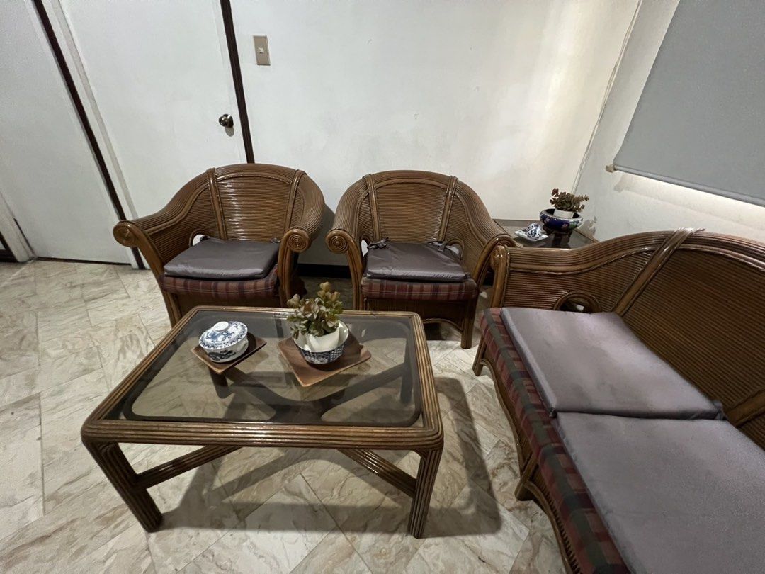 Rattan Sofa Set with Coffee Table (Category: Sofas) located in Mandaluyong City. Submitted by nadsfranco (Listing ID 1443721954, Image 2). Description: - 3-piece rattan sofa set - Includes: 1x 2-seater sofa, 2x armchairs - Comes with a glass-top coffee table - Cushions are included - Ideal for living rooms or patios.
