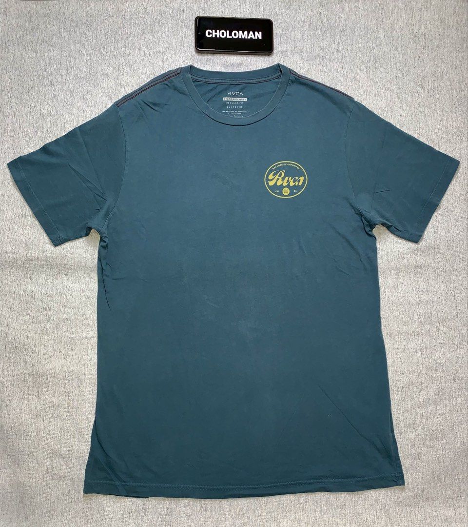 RVCA Men’s Pils Graphic T-shirt (Category: Activewear) located in Angeles City. Submitted by _choloman (Listing ID 1443761272, Image 1). Description: RVCA Men’s Pils Graphic T-shirt Size: XL Dimensions: 33L x 24W Fabric: 100% Cotton Color: Duck Blue Color Rate: 9/10 Condition: 9/10 (Used - Good) Issue: None [Actual color may vary due to lighting] Price: ₱550 Shipping via J&T Express = Buyer’s expense 📍 Location: Pampanga.