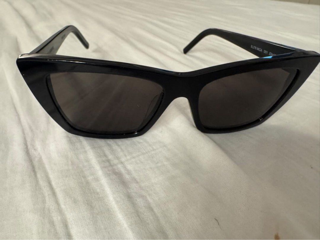 Saint Laurent Black Cat-Eye Sunglasses (Category: Luxury Accessories) located in Quezon City. Submitted by tinemarcelo (Listing ID 1443711016, Image 3). Description: - Authentic Saint Laurent sunglasses - Stylish black cat-eye frames - Includes original case - Comes with authenticity card - Versatile for daily wear or special events - Selling used once only.