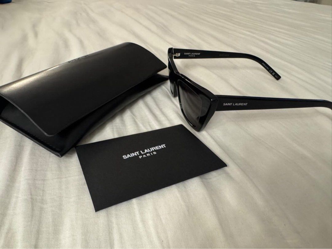 Saint Laurent Black Cat-Eye Sunglasses (Category: Luxury Accessories) located in Quezon City. Submitted by tinemarcelo (Listing ID 1443711016, Image 2). Description: - Authentic Saint Laurent sunglasses - Stylish black cat-eye frames - Includes original case - Comes with authenticity card - Versatile for daily wear or special events - Selling used once only.