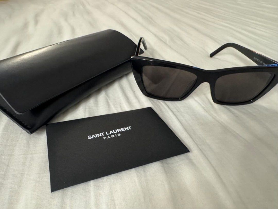 Saint Laurent Black Cat-Eye Sunglasses (Category: Luxury Accessories) located in Quezon City. Submitted by tinemarcelo (Listing ID 1443711016, Image 1). Description: - Authentic Saint Laurent sunglasses - Stylish black cat-eye frames - Includes original case - Comes with authenticity card - Versatile for daily wear or special events - Selling used once only.