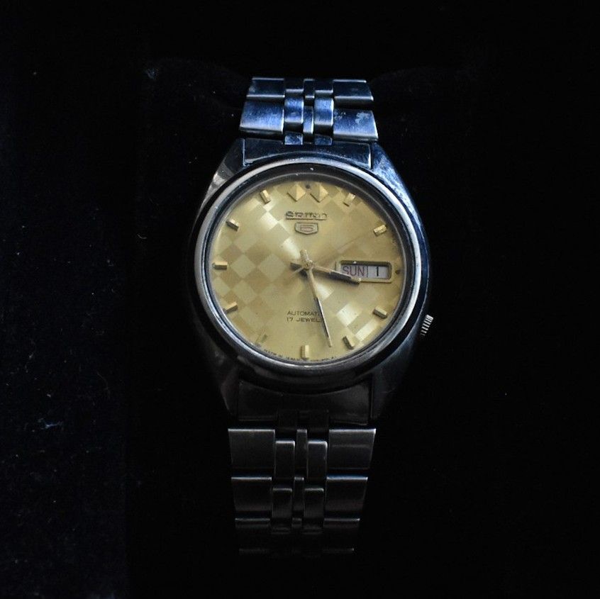 Seiko 5 Automatic Watch - Gold Dial (Category: Men's Watches) located in Makati City. Submitted by _damitnilawrence (Listing ID 1443795847, Image 2). Description: - Vintage Seiko 5 Automatic Watch - 37mm case - Serial 7009-3040 - Rpoduction 1981 or 1991 - Striking Gold Checkered Dial - Day and Date Complication - Stainless Steel Bracelet with Seiko Clasp - Water Resistant - Base Metal Bezel - Shows some signs of wear on case and bracelet - Runs w