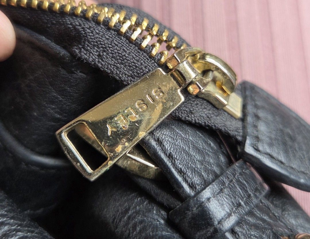 Sisley Black Leather Shoulder Bag (Category: Shoulder Bags) located in San Juan City. Submitted by mjdeclutters (Listing ID 1443799916, Image 3). Description: Brand: Sisley Material: Black Leather Hardware: Gold details Closure: Top zip strap: Adjustable shoulder strap .