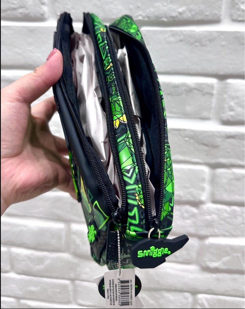 Smiggle Dino pencil holder pouch (Category: Babies & Kids Fashion) located in Singapore. Submitted by newleaf24 (Listing ID 1443734826, Image 2). Description: Condition: brand new with tag Original price: $27.95 $3.20 apply for tracked postage.