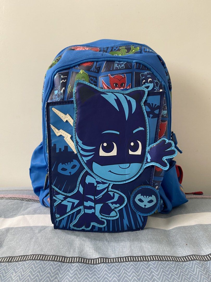 Smiggle PJ Masks Catboy Backpack (Category: Babies & Kids Fashion) located in Santa Rosa. Submitted by summerbrunch (Listing ID 1443709199, Image 1). Description: - Blue Smiggle backpack featuring popular PJ Masks characters. - Front pouch with an awesome Catboy design. - Convenient side mesh pockets for water bottles. - Adjustable padded shoulder straps for maximum comfort. - Includes an inside name tag for easy identification. - Ideal for schoo