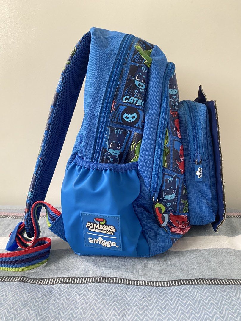 Smiggle PJ Masks Catboy Backpack (Category: Babies & Kids Fashion) located in Santa Rosa. Submitted by summerbrunch (Listing ID 1443709199, Image 2). Description: - Blue Smiggle backpack featuring popular PJ Masks characters. - Front pouch with an awesome Catboy design. - Convenient side mesh pockets for water bottles. - Adjustable padded shoulder straps for maximum comfort. - Includes an inside name tag for easy identification. - Ideal for schoo