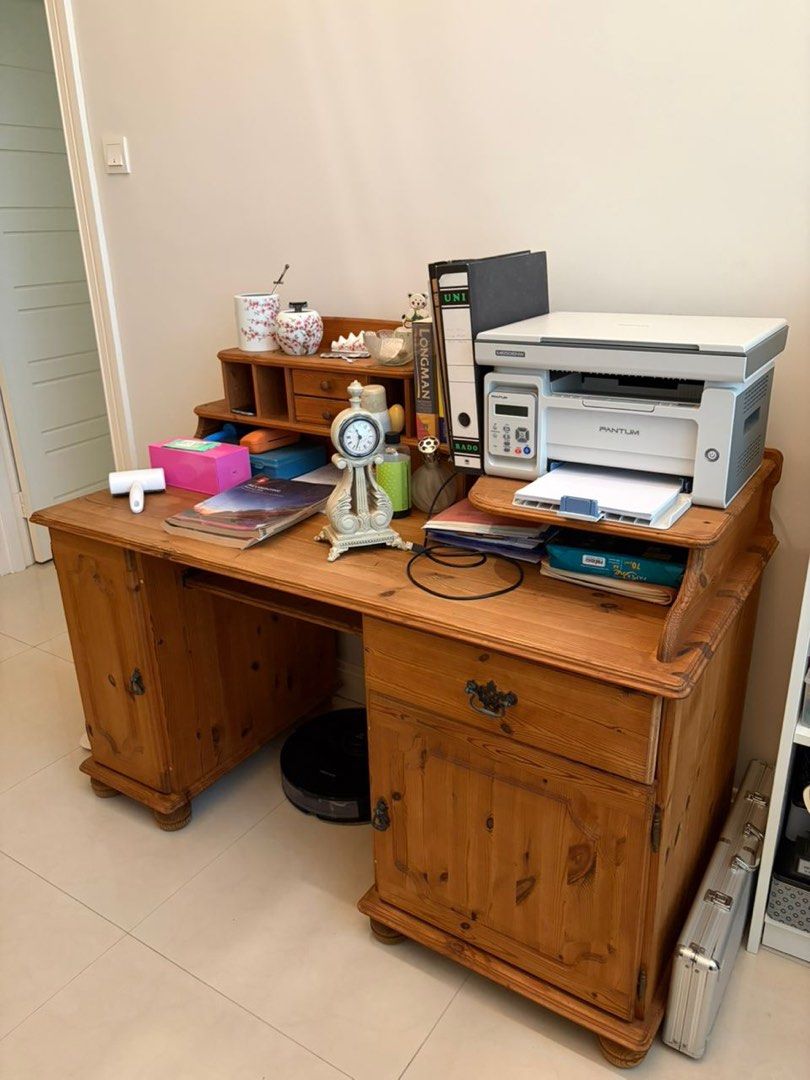Solid wood study table (Category: Tables & Sets) located in Subang Jaya. Submitted by sweenyy (Listing ID 1443837517, Image 1). Description: - Solid wood desk with hutch - Ample storage: drawers, cabinets, and hutch compartments - Convenient pull-out keyboard tray - Ideal for home office or study space - Shows some signs of wear on the surface 136length 63width 71height.