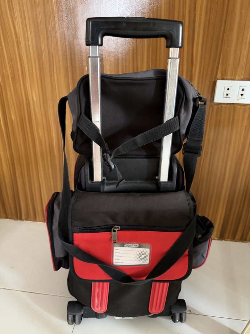 Sparky Trolley Bag (Category: Strollers) located in Caloocan City. Submitted by j.affordafindsph (Listing ID 1443668726, Image 3). Description: Authentic Puffy and Sparky Large Upright Stroller. Red and grey colorway. Has a retractable handle and wheels for easy transport. Multiple compartments and pockets for organization. Great for school or travel. Durable material. Detachable zippered side pocket on the other side Identification label at the 