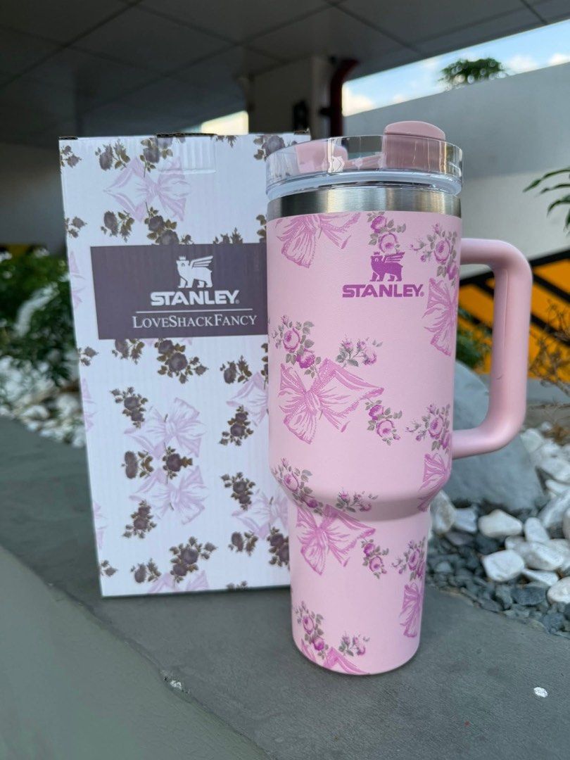 Stanley x LoveShackFancy Tumbler with Handle (Category: Water Bottles & Tumblers) located in Manila. Submitted by bautistasa98034 (Listing ID 1443905881, Image 2). Description: - Authentic Stanley x LoveShackFancy collaboration tumblers. - Available in multiple charming floral designs and colors: white with pink roses, pink with bows and roses, purple floral, and blue floral. - Each tumbler includes its original packaging. - Perfect for maintaini