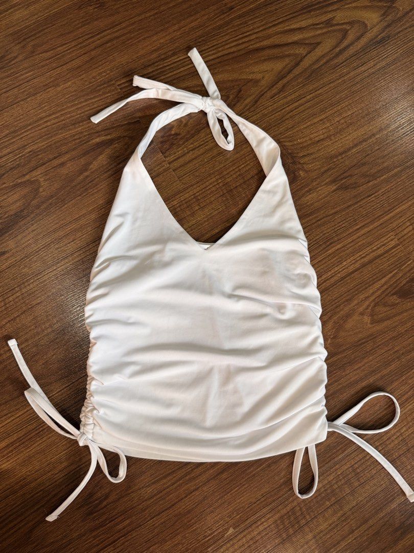 Supre White Ruched Halter Top XS (Category: Sleeveless) located in Quezon City. Submitted by closetcute (Listing ID 1443815999, Image 1). Description: Ruched sides with adjustable drawstring ties Ties at the neck for a customizable fit .