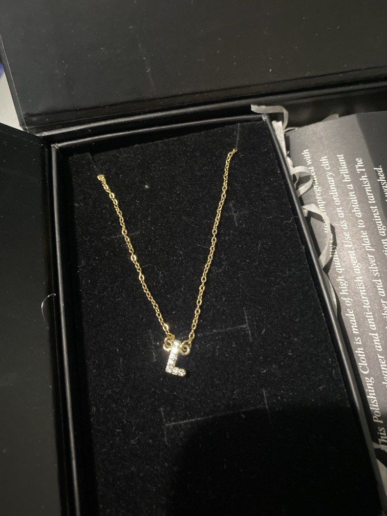 Tala by Kyla Initial Necklace L - Gold (Category: Other Accessories) located in Las Pinas. Submitted by charlee26 (Listing ID 1443893161, Image 3). Description: -unused, decluttering -comes with box and cleaner -initial is letter L in gold MOP: Gcash, Bank Transfer Loc: Las Piñas, Parañaque, Manila.