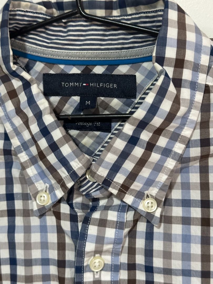Tommy Hilfiger Checkered Button Down Shirt (Category: Formal Shirts) located in Balagtas. Submitted by bookplug_ph (Listing ID 1443787209, Image 1). Description: Length: 29 inches Width: 22 inches.
