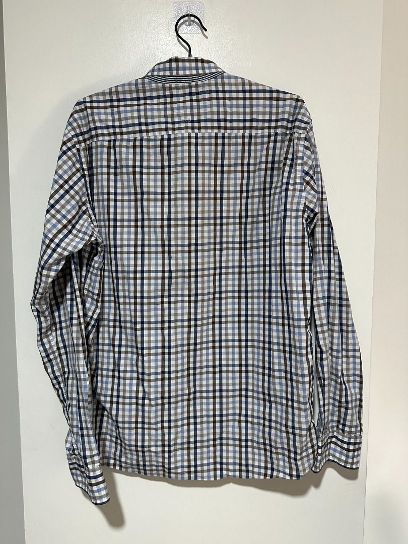 Tommy Hilfiger Checkered Button Down Shirt (Category: Formal Shirts) located in Balagtas. Submitted by bookplug_ph (Listing ID 1443787209, Image 3). Description: Length: 29 inches Width: 22 inches.