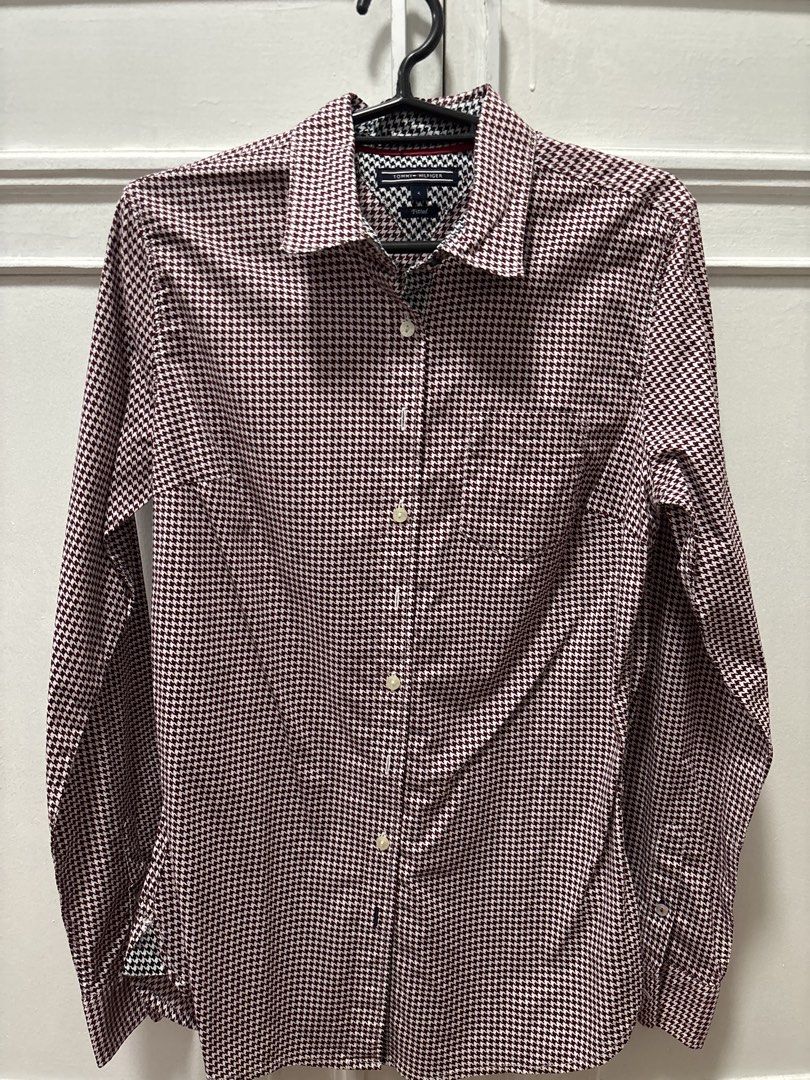 Tommy Hilfiger Men's Long Sleeve Button Down Shirt (Category: Tshirts & Polo Shirts ) located in Imus. Submitted by karoleiza (Listing ID 1443801336, Image 1). Description: - Classic Tommy Hilfiger button-down shirt - Eye-catching red and white houndstooth pattern - Long sleeves with button cuffs - Convenient single chest pocket on the left - Stylish contrasting patterned collar lining - Perfect for smart casual outfits.