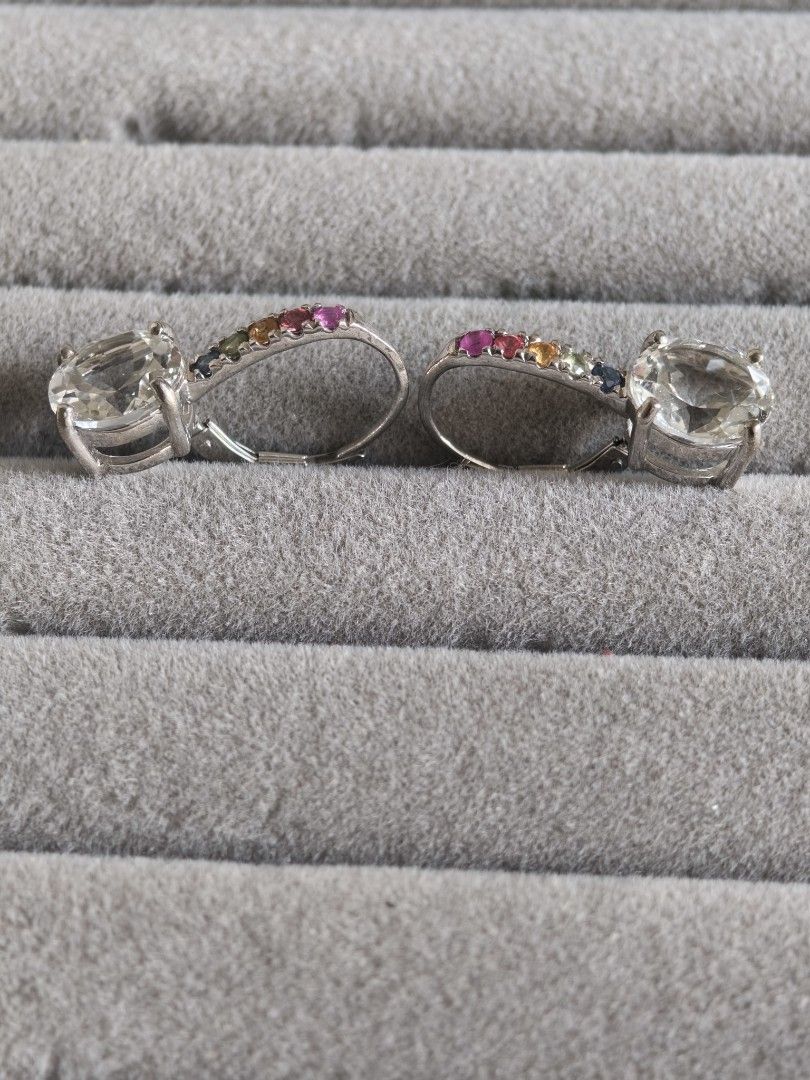 Topaz Drop Earrings with multi-color sapphire (Category: Earrings) located in Batangas. Submitted by decluttering_bliss (Listing ID 1443790473, Image 2). Description: - Dazzling drop earrings - Features a large clear white topaz at the bottom - Top section adorned with colorful gemstones: pink, orange, yellow, blue, and purple - Silver-tone metal - Suitable for pierced ears - Elegant dangling design.