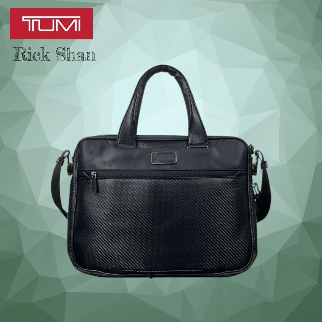 TUMI McLaren Axle Slim Brief features CX6 (Category: Briefcases) located in Manila. Submitted by r1ckshan (Listing ID 1443716896, Image 2). Description: TUMI briefcase in black. Features a carbon fiber textured exterior. Has top handles and a detachable shoulder strap. Multiple compartments for organization. Great for work or travel. Check photos for details. Price: 12,500 Location: Laguna Binan MOP: GCASH & MAYA SHIPPING: LALAMOVE, LBC.