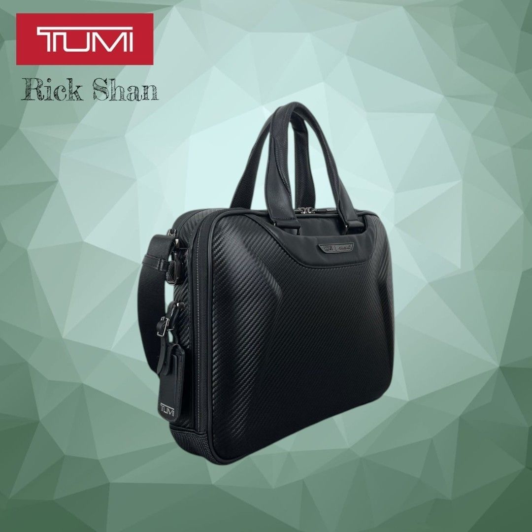 TUMI McLaren Axle Slim Brief features CX6 (Category: Briefcases) located in Manila. Submitted by r1ckshan (Listing ID 1443716896, Image 3). Description: TUMI briefcase in black. Features a carbon fiber textured exterior. Has top handles and a detachable shoulder strap. Multiple compartments for organization. Great for work or travel. Check photos for details. Price: 12,500 Location: Laguna Binan MOP: GCASH & MAYA SHIPPING: LALAMOVE, LBC.