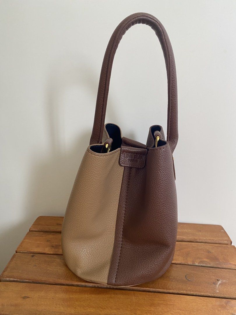 Two-tone brown bucket bag with top handle (Category: Cross-body Bags) located in Santa Rosa. Submitted by summerbrunch (Listing ID 1443712141, Image 1). Description: - Adorable two-tone brown bucket bag - Convenient top handle for easy carrying - Interior zipped pocket for secure storage - Magnetic snap closure for quick access - Chic gold hardware details - Ideal for your everyday adventures.