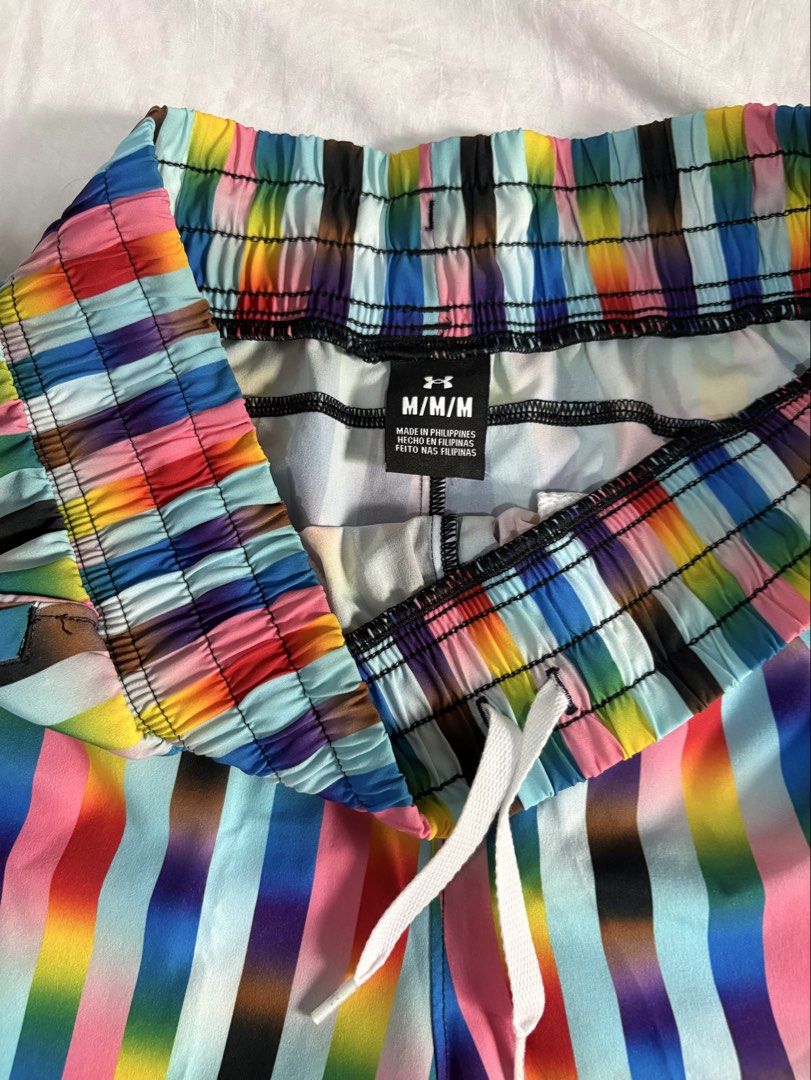 Under Armour Flex Woven 5inch Pride Shorts M/M #pridemonth (Category: Shorts) located in Taguig. Submitted by amiwear (Listing ID 1443883121, Image 3). Description: - Brand: Under Armour - Style: Rainbow striped athletic shorts - Size: Medium (M) - Features: Elastic waistband with drawstring, side pockets - Ideal for: Running, workouts - Design: Vibrant and eye-catching print - Origin: Made in the Philippines RFS: Declutterring MOP: BPI/UB Condit