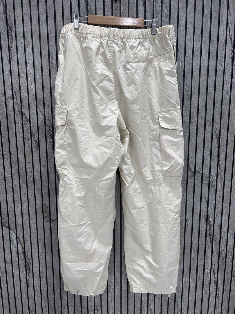 Uniqlo Parachute Pants Beige (Category: Joggers) located in Malasiqui. Submitted by blckfourthrift (Listing ID 1443816243, Image 2). Description: Uniqlo Parachute Pants Beige Carpenter Fit Waist: 36 Length: 44 Leg Opening: 8.5 Issue/s: Stains .