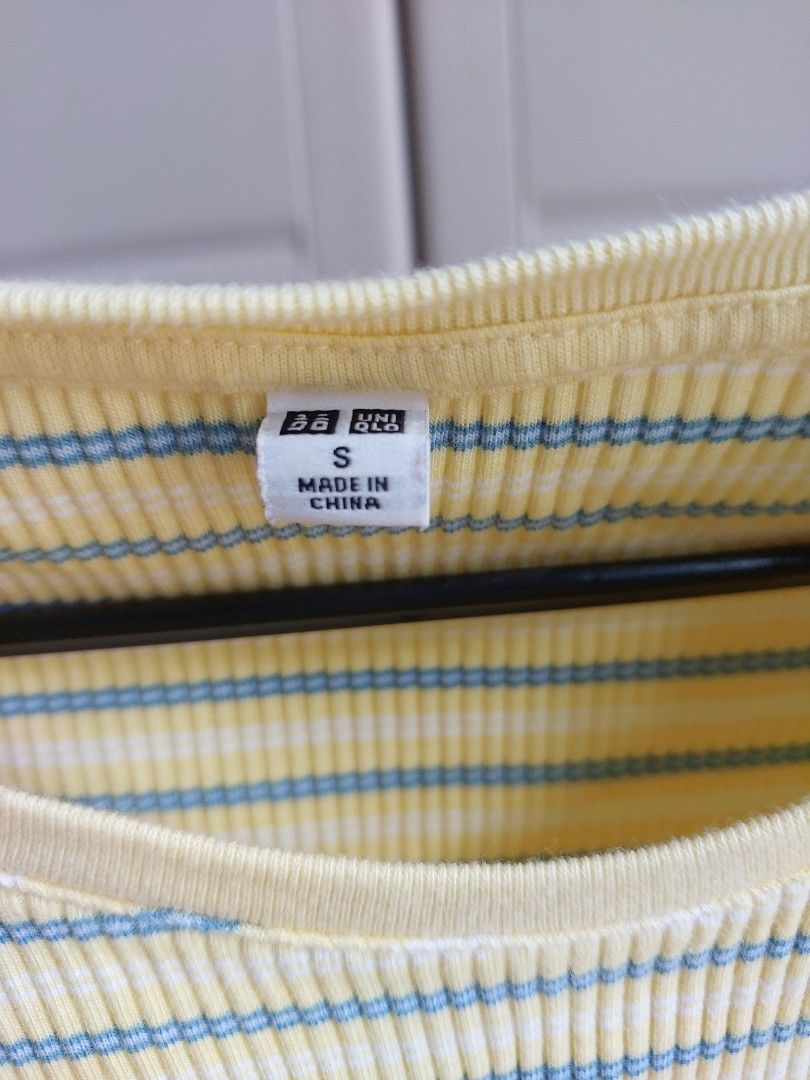 UNIQLO Striped Ribbed Top Size S (Category: Shirts) located in Pasay City. Submitted by mcleo10 (Listing ID 1443769823, Image 3). Description: - Yellow ribbed top - Features blue stripes - Lettuce hem detail on sleeves and bottom - Estimated size: Small (S) - Ideal for casual wear.