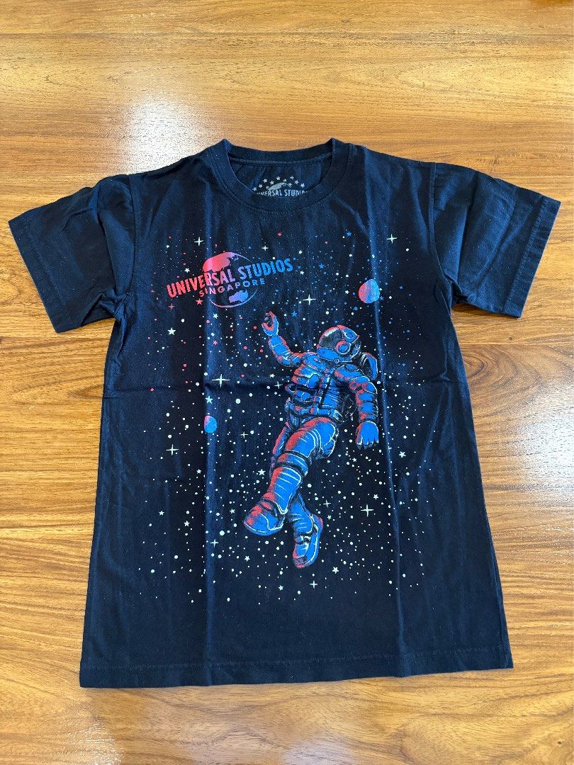Universal Studios Singapore Astronaut Black Graphic Tee (Category: Shirts) located in Bacolod City. Submitted by formicary (Listing ID 1443886616, Image 1). Description: Black T-Shirt from Universal Studios Singapore, features a cool astronaut graphic in space - 100% Cotton, fits small to medium. 🌿 Condition: Great! Worn once or twice 🛒 RFS: Decluttering! 💸 MOP: GCash or BPI [Seller is in Bacolod, buyer will shoulder the shipping fee.] .