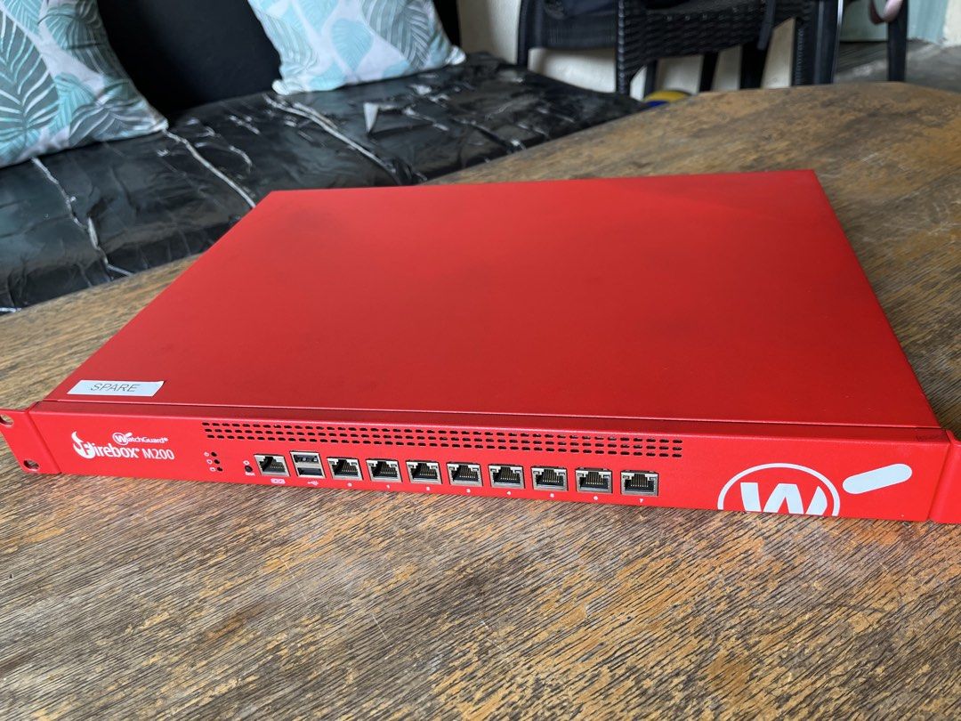 WatchGuard Firebox M200 Network Security Appliance (Category: Networking) located in Caloocan City. Submitted by msitrealtor (Listing ID 1443768418, Image 2). Description: - WatchGuard Firebox M200 Firewall - Vibrant Red Casing - Multiple Network Ports on Front - Rack-Mountable Unit - Features a 'SPARE' sticker on top - Excellent for enhancing network security.