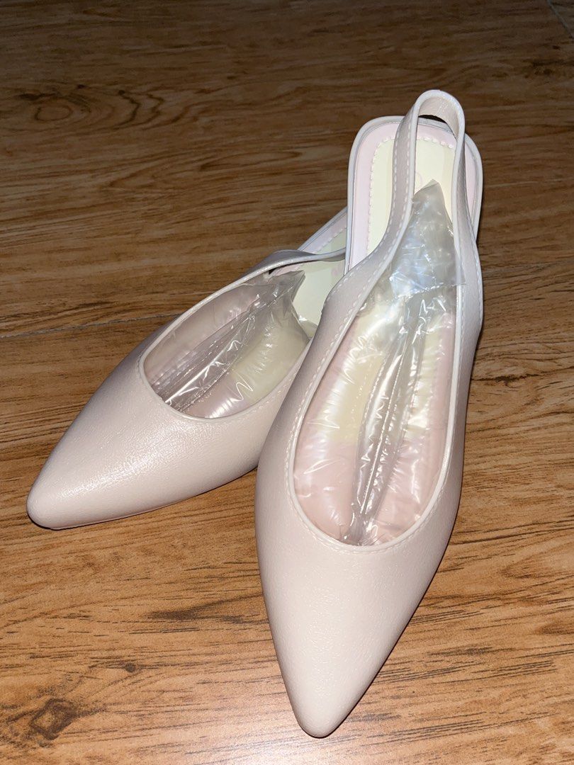 Women's Pointed Toe Slingback Heels (Category: Heels) located in Manila. Submitted by declutter0_0 (Listing ID 1443809096, Image 1). Description: - Light pink pointed toe slingback heels - Size 38 (avail also 36 used once same color) - Low block heel for comfortable wear - Stylish clear strap detail - Textured sole for enhanced grip - Versatile: great for dressing up or down.