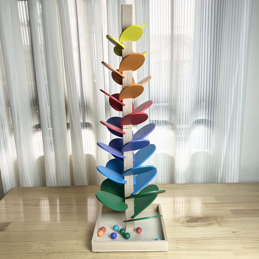Wooden Music Tree (Category: Educational & Learning Toys) located in Pasig City. Submitted by timberthinksph (Listing ID 1443880546, Image 1). Description: - Fun wooden marble tree toy - Watch marbles cascade down colorful leaves - Comes with a set of marbles - Great for developing fine motor skills - Smooth wood and vibrant colors - Ready for a new home!.