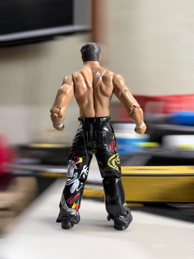 WWE Jakks Pacific Tajiri Figure (Category: Action & Battle Toys) located in Mandaluyong City. Submitted by joshlim (Listing ID 1443806939, Image 2). Description: WWE Jakks Pacific Tajiri action figure. Features detailed physique, flame-design pants, wristbands, and boots. Poseable. Great for collectors..