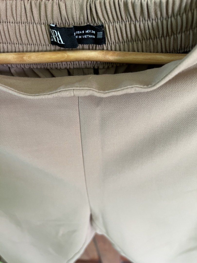 Zara Beige Cropped Pants with Button Detail (Category: Other Bottoms) located in San Fernando. Submitted by prettyfinds2021 (Listing ID 1443731647, Image 2). Description: - Zara beige pants - Cropped length - Comfortable elastic waistband at the back - Decorative buttons on front pockets - Versatile for casual and smart casual outfits - Easy to style with various tops ***GET THE TWO ZARA TROUSERS FOR ONLY ₱1,000***.