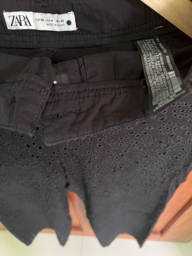 ZARA Black Eyelet Cropped Pants (Category: Other Bottoms) located in San Fernando. Submitted by prettyfinds2021 (Listing ID 1443731558, Image 2). Description: - Black cropped pants from ZARA - Unique all-over eyelet pattern - Chic scalloped hem detail - Secure button and zip closure - Estimated size: US 4 - Perfect for casual or dressed-up looks ***GET THE TWO ZARA TROUSERS FOR ONLY ₱800***.