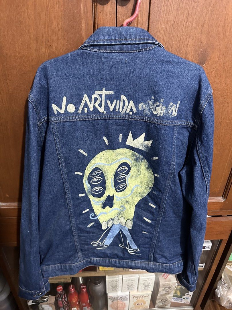 Zara Man Denim Jacket with Custom Skull Art (Category: Coats, Jackets and Outerwear) located in Rizal. Submitted by colosas (Listing ID 1443860844, Image 1). Description: Zara Man denim jacket, Size L. Features a hand-painted skull graphic with 'NO ART VIDA ORIGINAL' text on the back. Classic button-up style..