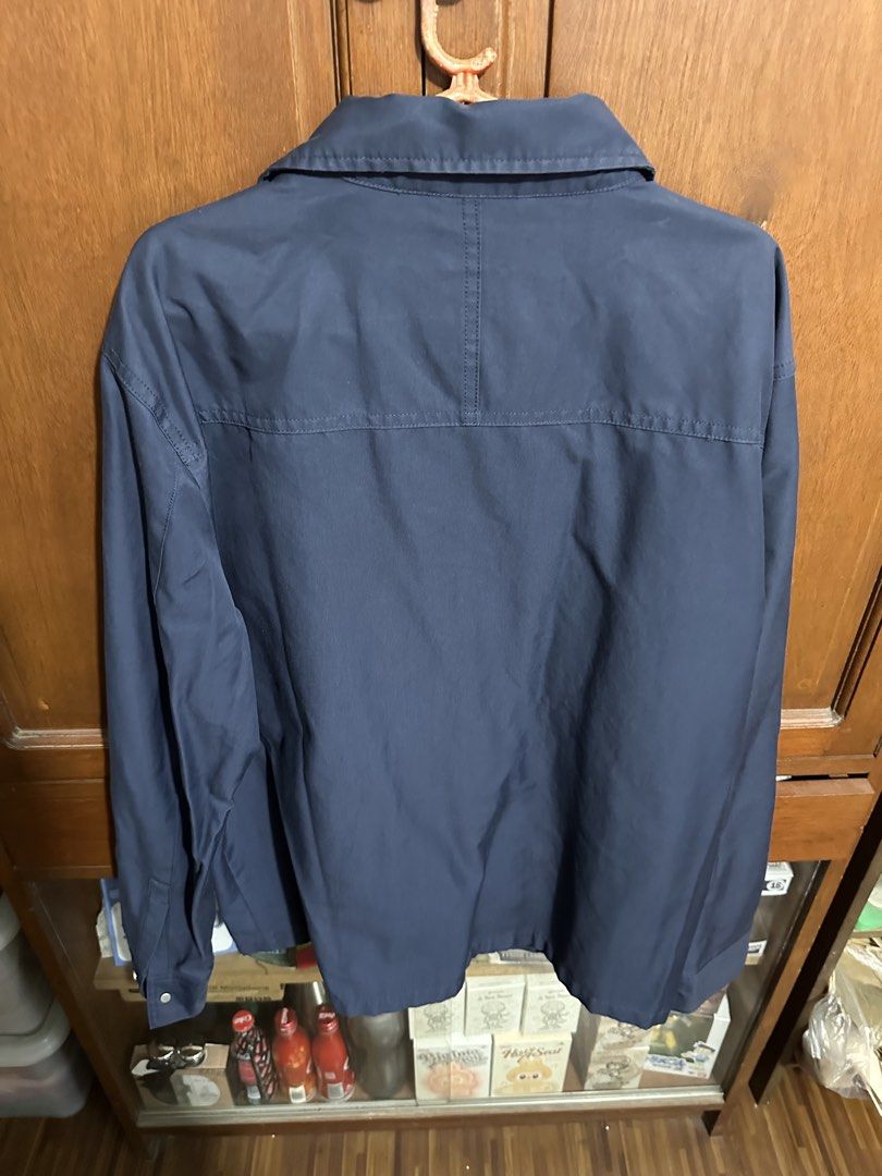 Zara Navy Blue Jacket Size L ( mens) (Category: Coats, Jackets and Outerwear) located in Rizal. Submitted by colosas (Listing ID 1443861270, Image 2). Description: Navy blue Zara jacket, Size L. Features a collared neckline, button-up front, and two button-closure pockets. Perfect for layering..