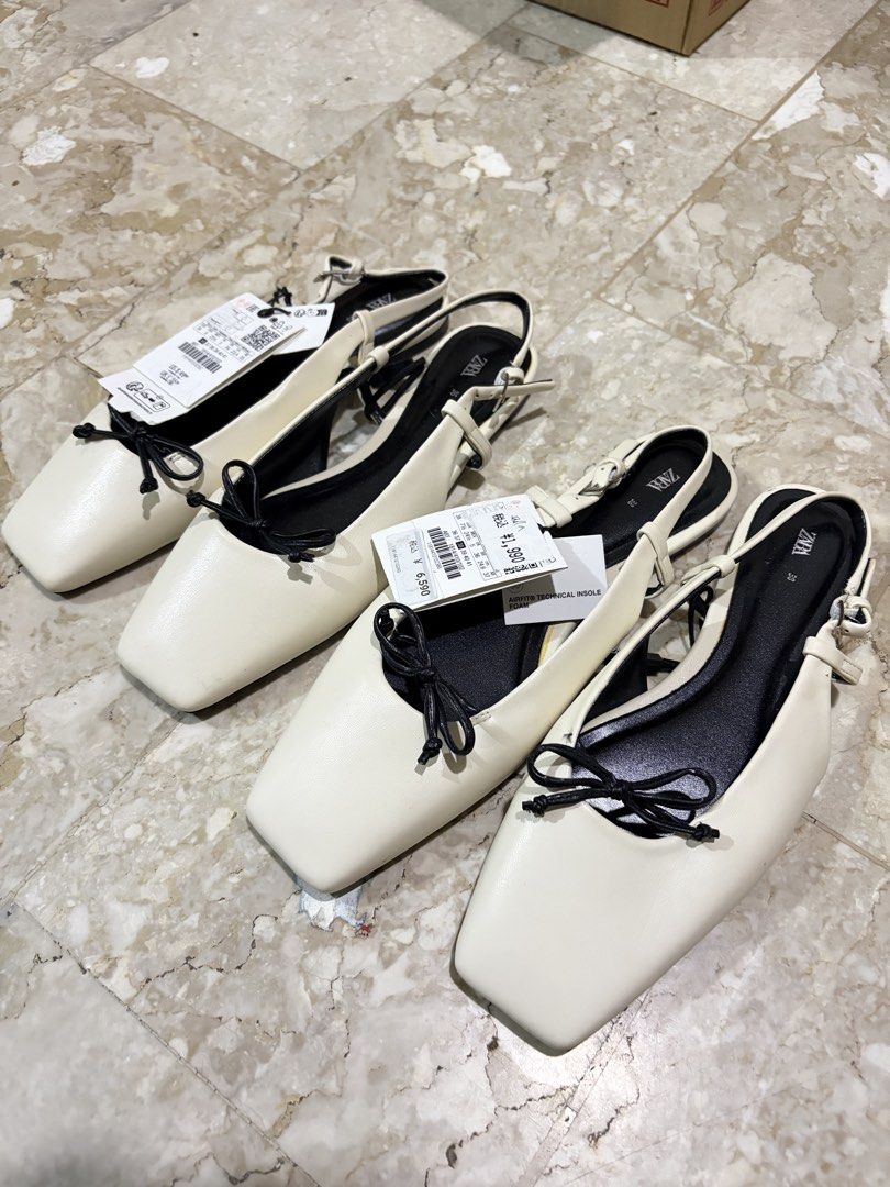 Zara Slingback Flats with Bow Detail (Category: Flats & Sandals) located in Manila. Submitted by missapparelph (Listing ID 1443902469, Image 1). Description: - Brand: Zara Sizes: 36 & 38 - Style: Slingback Flats - Color: Cream/Off-white - Toe Shape: Square - Detail: Cute black bow on the front - Strap: Adjustable strap at the heel - Size: 38 - Condition: Brand new, never worn, still has tags attached..