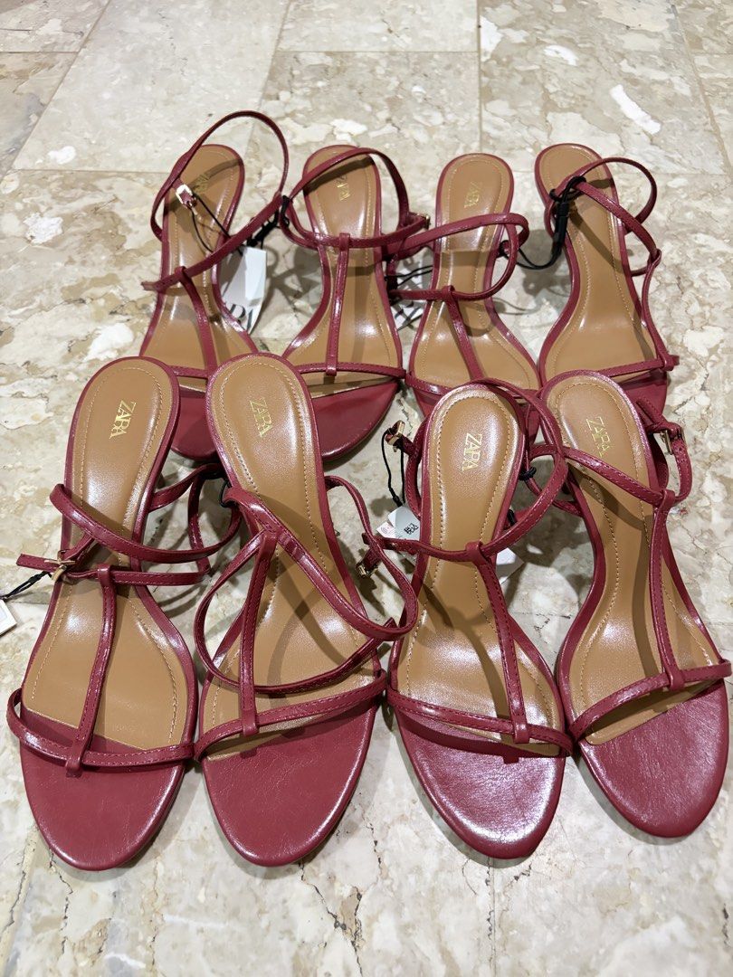 ZARA Strappy Heeled Sandals (Category: Heels) located in Manila. Submitted by missapparelph (Listing ID 1443902370, Image 1). Description: - ZARA Strappy Heeled Sandals - Color: Reddish Sizes: 35, 36, 37, 38, 39 - Features delicate straps with buckle closure - Classic T-strap design - Perfect for dressing up any outfit.