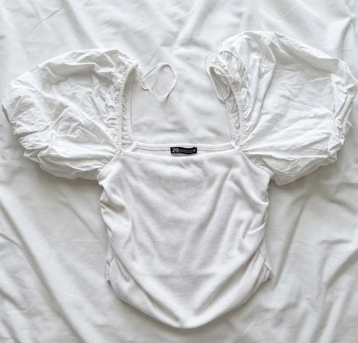 Zara White Orange Puff Sleeve Ruched Top (Category: Blouses) located in Manila. Submitted by topbrandsspendless (Listing ID 1443893758, Image 1). Description: - WO tag yet never been used - In excellent condition literally no issues (kase never used nga! Kaya get mo na) - bought in Japan EUR: M USA: M MEX:28 .