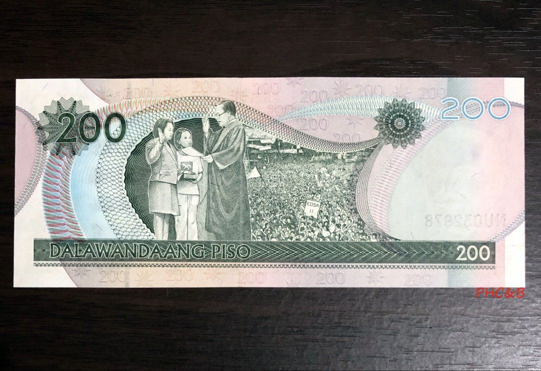 2011 200 Piso UST 400 Commemorative Banknote Overprint Banknote (Category: Currency) located in Valenzuela. Submitted by phcoins.banknotes08 (Listing ID 1443993790, Image 2). Description: 2011 200 Piso UST 400 Commemorative Banknote Overprint Banknote Uncirculated Grade - Authentic 200 Philippine Peso banknote - Features President Diosdado Macapagal on the front - Year 2011 clearly visible - Back displays a significant historical event - Ideal fo