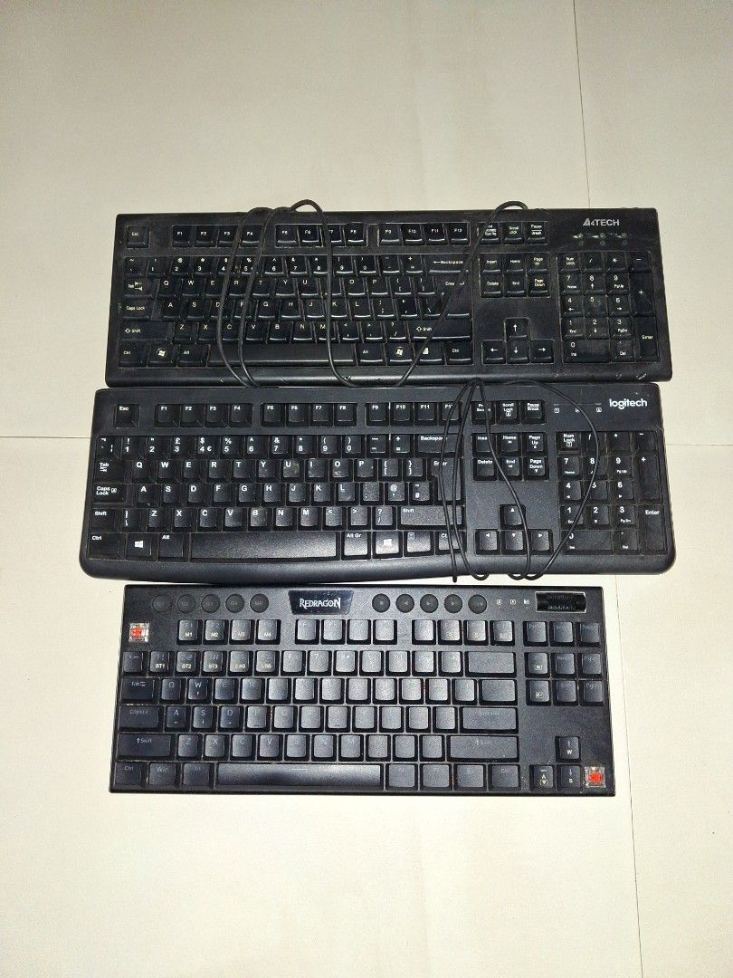 3x Black Computer Keyboards - Logitech, A4Tech, and more (Category: Computer Keyboard) located in Cavite. Submitted by 92939494959597 (Listing ID 1443974446, Image 1). Description: - Bundle of 3 black wired computer keyboards - Includes Logitech, A4Tech, and red dragon keyboards -AS IS.