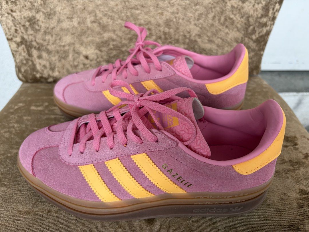 Adidas Bold Gazelle Sneakers (Category: Sneakers) located in Makati City. Submitted by tomfordgal (Listing ID 1444008070, Image 2). Description: The adidas Gazelle Bold in pink and yellow colorways—often found under the “Spark Lucid Pink” or “Bliss Pink Spark” monikers—is an iconic retro sneaker reimagined with a triple-stacked platform. It features a premium suede upper, platform gum-rubber outsole, and vibrant contrast 3-Stripes..