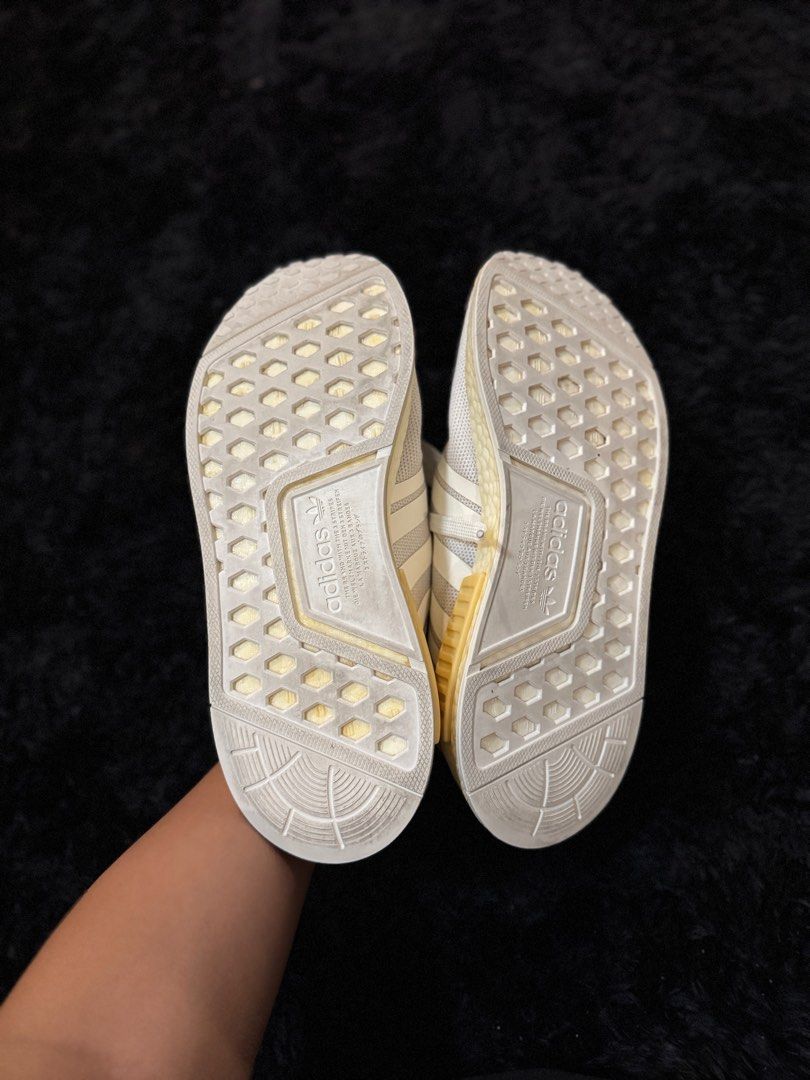 Adidas NMD R1 Triple White (Category: Sneakers) located in Quezon City. Submitted by lyhraaa (Listing ID 1444038300, Image 3). Description: Adidas NMD R1 Condition: 7/10 bcos of yellow stains Less than 5x ko lang to nasuot Huhuhu * Still structurally solid and comfortable * No major tears or sole separation * Some signs of use and storage * Midsole and plastic blocks have visible yellowing due to age/storage (see photos) * Upper remains in decent