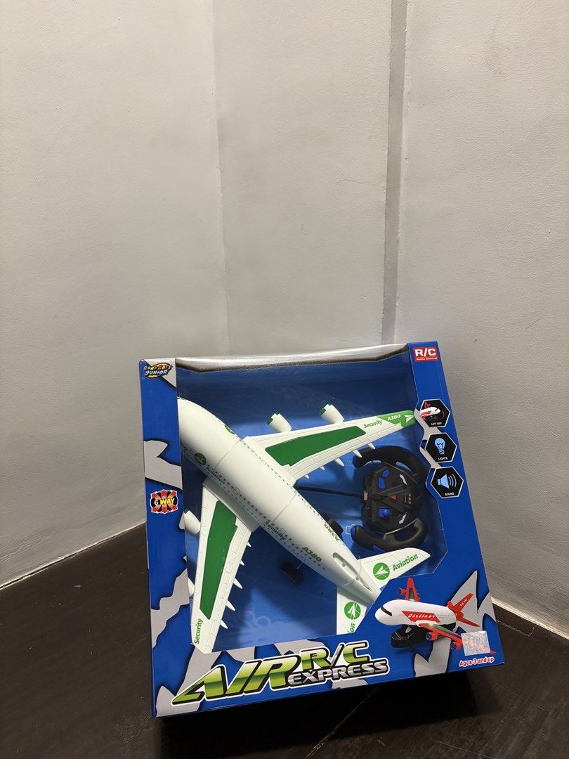 Air Express RC Airplane Toy with Remote Control (Category: Remote Control Toys) located in Valenzuela. Submitted by clothes_asell (Listing ID 1444024695, Image 1). Description: - RC Air Express airplane toy - Includes remote control - White and green airplane design - Box shows two airplane options (A & B) - Perfect for playtime.